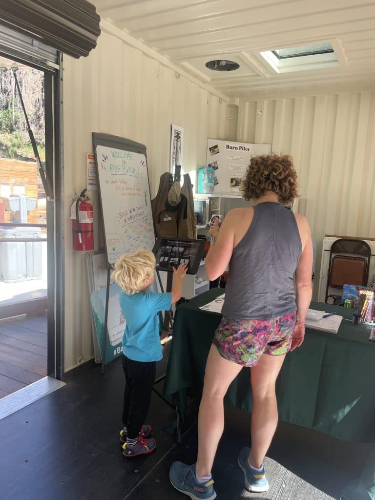 child navigating ipad kiosk